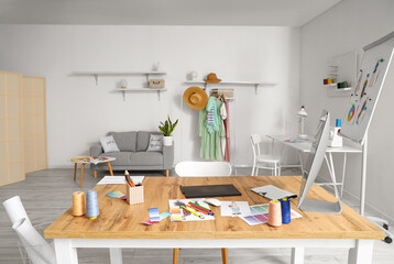 Workplace of clothes stylist in studio