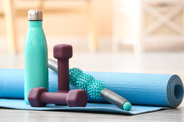 Stylish sport equipment on floor in room