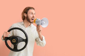 Angry man with steering wheel and megaphone on color background