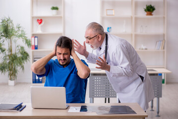 Two male doctors working in the clinic