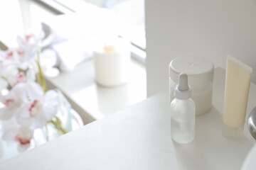 Fototapeta na wymiar Cosmetic products on shelf in bathroom, closeup