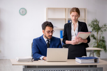 Two colleagues working in the office