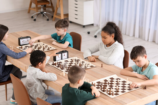 Children's Restraining Hand Thoughtfully Figure Before The Next Chess Move  Stock Photo, Picture and Royalty Free Image. Image 77247675.