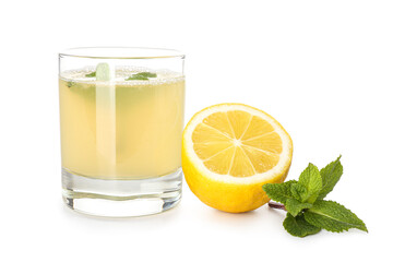 Glass with fresh lemon juice on white background