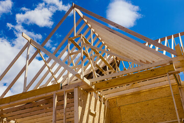 Wooden beams at construction the roof truss system house - obrazy, fototapety, plakaty