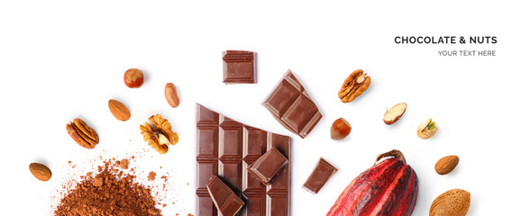 Creative layout made of chocolate, walnut, hazelnut, almonds, cacao fruit and cacao powder on the white background. Flat lay. Food concept. 