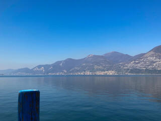 Obraz premium Bergamo, Italy: 10-02-2022: Panoramic of Lake Iseo, the fourth largest&nbsp;lake&nbsp;in&nbsp;Lombardy, Italy, fed by the&nbsp;Oglio River.
