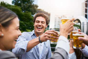 With all the hard work they do they should celebrate. Cropped shot of businesspeople having drinks on their office balcony.