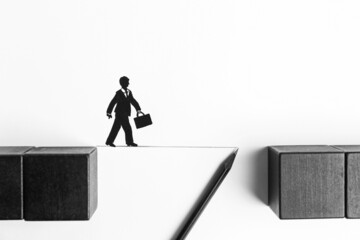 Drawing line with pencil between wooden cubes to help businessman figure cross bridge on white background, flat lay. Connection, relationships, support and deal concepts