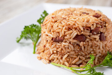 A view of a plate of rice and peas.