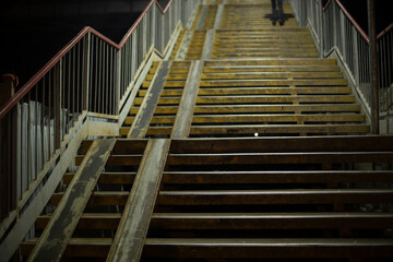 Stairs at night. Details of bus station. Pedestrian crossing.