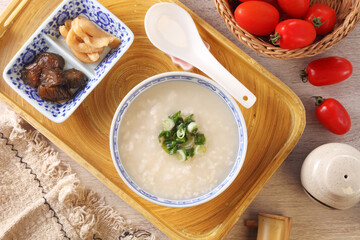 Rice porridge with spring onion on the table 