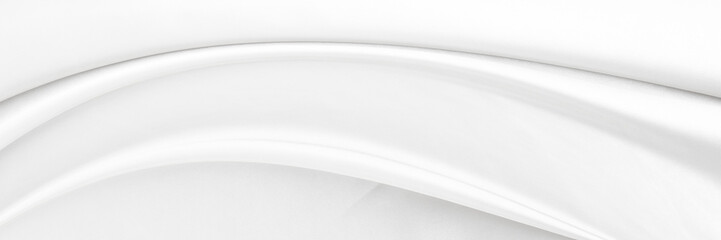 White gray satin texture that is white silver fabric silk panorama background with beautiful soft blur pattern natural.