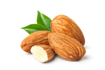 Almonds with cut in half and green leaves  isolated on white background.