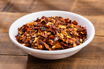 Crushed red pepper in a ceramic bowl