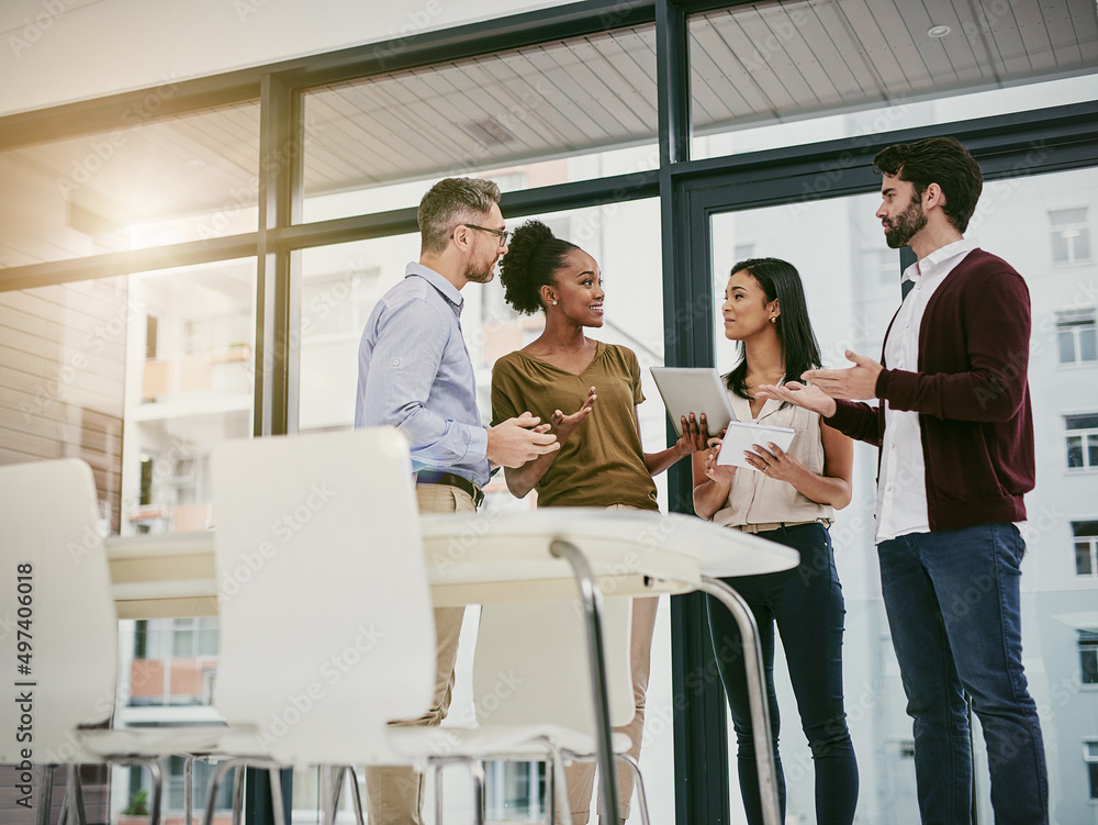 Poster discussing the status of business. shot of a group of colleagues having a meeting in a modern office