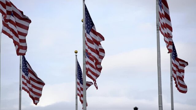 United States of America flags in slow motion. Flag Plaza in New Jersey. USA flags flying in the wind