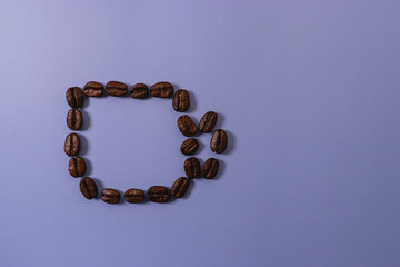cup of coffee with beans on blue background with cop space