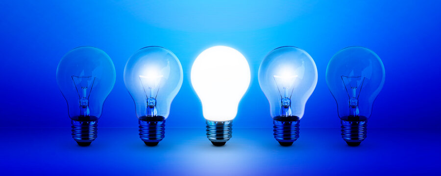 light bulb on blue background idea concept