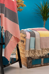 Peshtemal Turkish towel folded and open, colorful textile for spa, beach, pool, light travel,...
