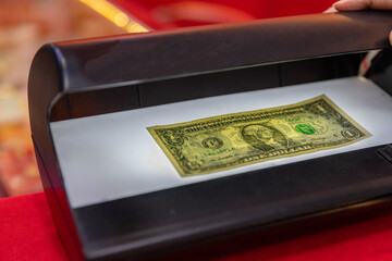 The banknote checker is used to test the validity of the banknote.