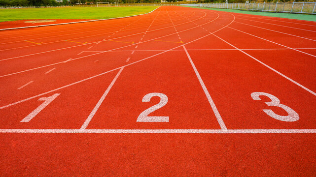 Outdoor stadium. Treadmill  tracks for running in a street stadium, close-up. Competition concept, finish or start