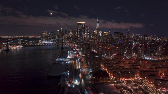 Aerial Hyperlapse over East river at night with moonset 