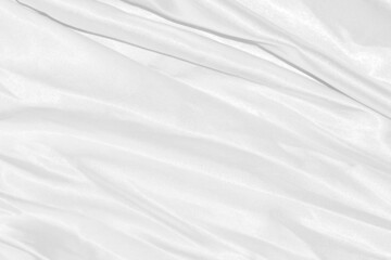 Closeup elegant crumpled of white silk fabric cloth background and texture