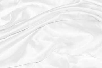 Closeup elegant crumpled of white silk fabric cloth background and texture