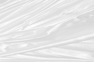 Closeup elegant crumpled of white silk fabric cloth background and texture