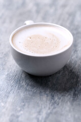 Coffee with milk on wooden background. Close up. Copy space. 