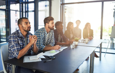 Theyll make success happen. Shot of a group of colleagues sitting in a boardroom meeting.