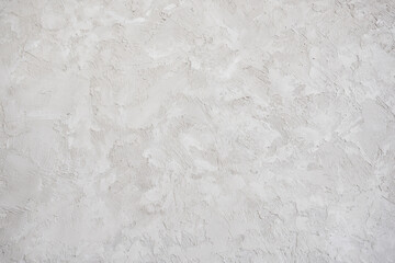 artistic plaster on a gray and white wall. Repairs. elements of wall decor. copy space. texture. background.