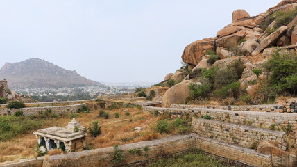 Fototapeta na wymiar Fort ruins and view of Kashi Vishvanath Temple, Chitradurga fort, Karnataka, India
