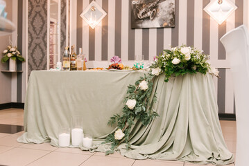 Hall decor for events, wedding decor, presidium and tables for guests with flowers, table decor elements
