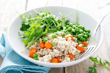 Barley porridge with green peas, baked pumpkin and fresh arugula salad