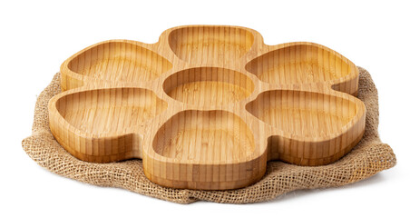 Wooden plate and tablecloth on white background