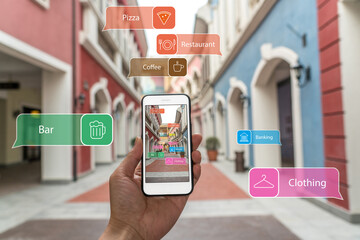 Augmented reality marketing street . Hand holding smart phone use AR application to check...