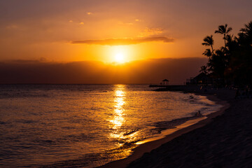 Sun sets over the sea. Beautiful view of the sea and the sky in the clouds at sunset. Orange red...