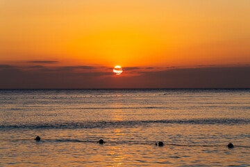 Beautiful view of the sea and the sky in the clouds at sunset. Orange red dawn, dusk on the sea...