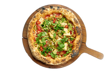 Vegetarian pizza with lots of vegetables on a wooden board, white background
