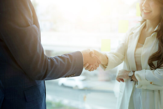 Business asian people shaking hands, finishing up meeting