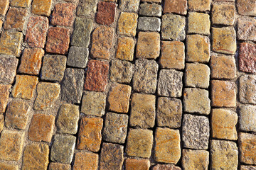 Cobbled stone road, close up, wet after rain