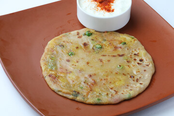 Aloo Paratha / Indian Potato stuffed Flatbread. Served with fresh curd and tomato ketchup. 