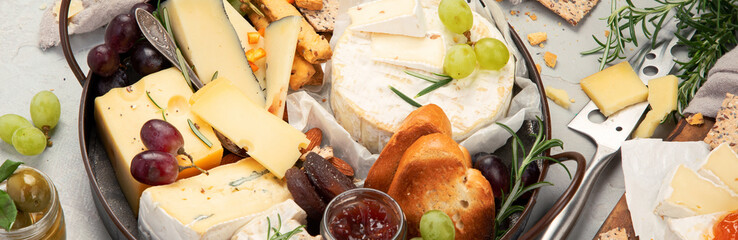 Cheese assortment on light background.