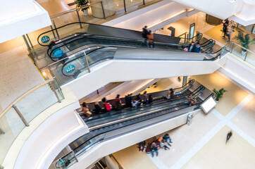 shopping mall, people in escalator, motion blur