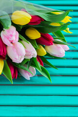Blurred tulips wooden background