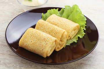 Stuffed pancakes with meat and cream