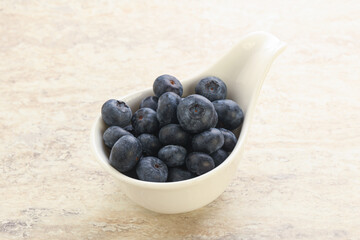 Sweet ripe blueberry heap in the bowl