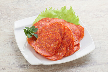 Sliced pepperoni sausage in the bowl